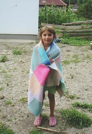 Andrea is happy to receive such a lovely hand-made blanket from England